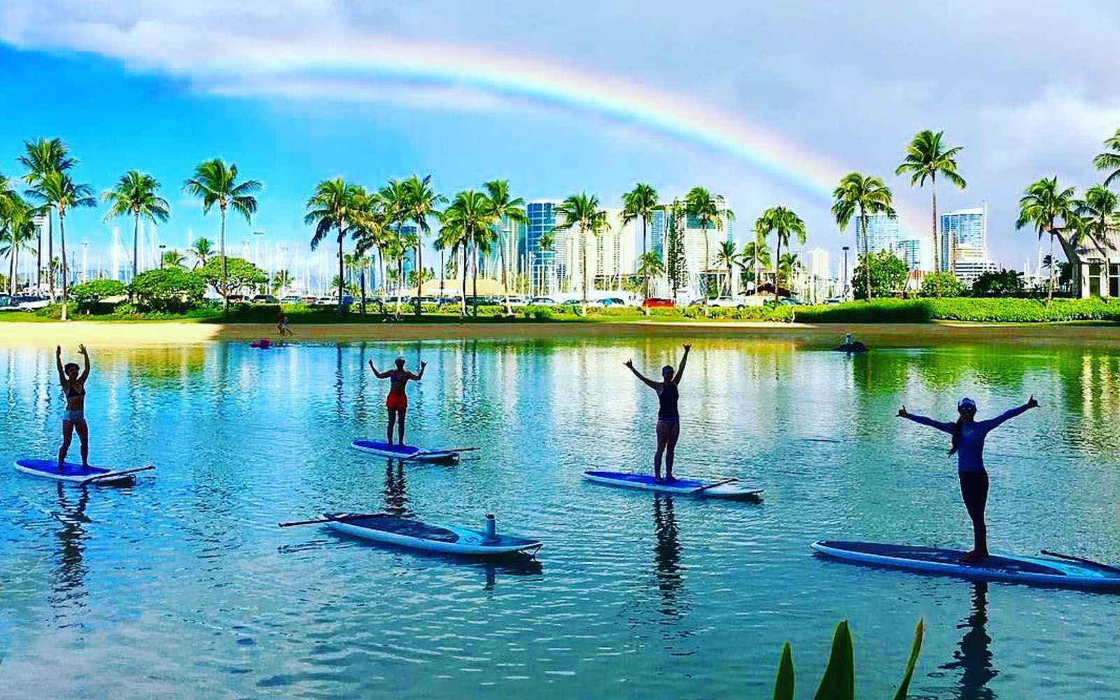 SUP yoga with rainbow